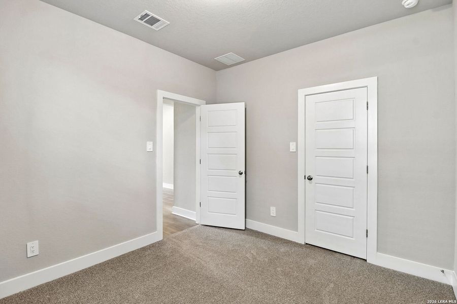 Spacious, unfurnished interior of a new home in Estancia Ranch - Premier Series, San Antonio (Image 20).