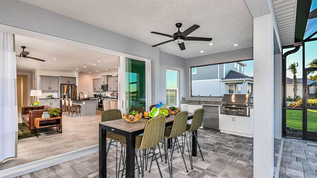 Exterior details and patio area of a home in SkySail Real Estate and Homes for Sale in Naples, FL - Neal Communities, Naples (Image 3).