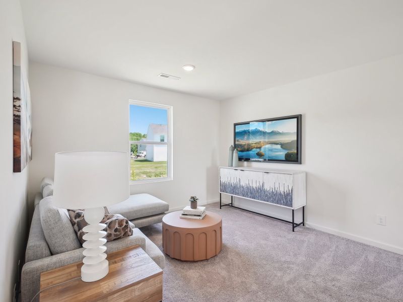 A living room with a tv and a couch.