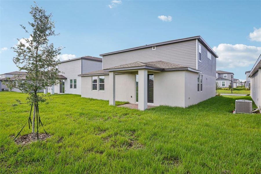 Exterior details and patio area of a home in The Meadow at Crossprairie, St. Cloud (Image 3).