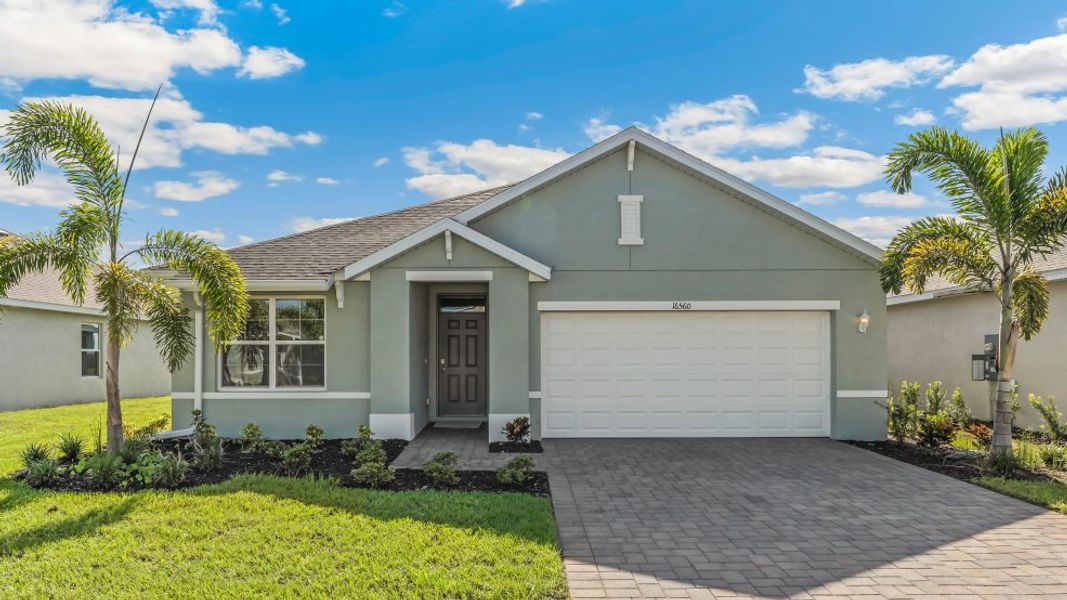 Front exterior of a new home in Driftwood Bay, Port Charlotte, FL, highlighting curb appeal (Image 1). Front exterior of a new home in Driftwood Bay, Port Charlotte, FL, highlighting curb appeal (Image 1).