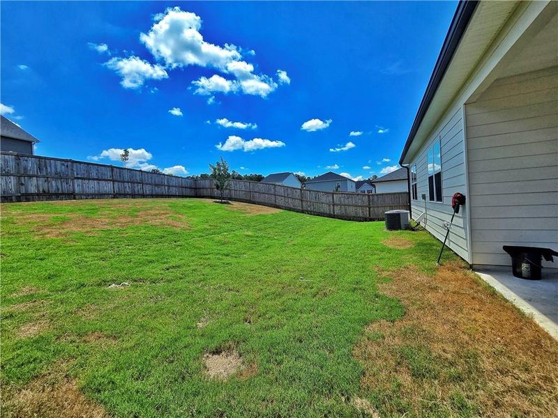 Exterior details and patio area of a home in Oakchase at Hampton, Hampton (Image 28).