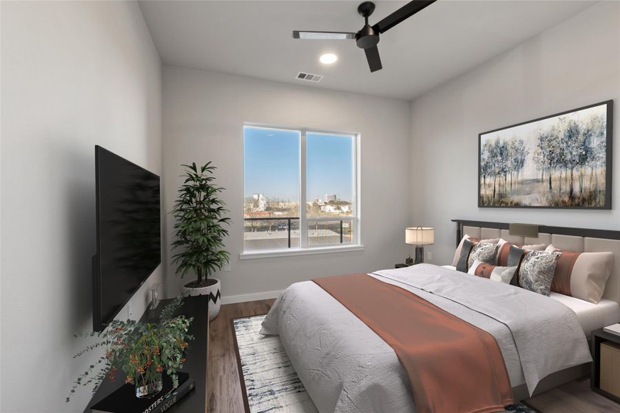 Bedroom with wood finished floors, a ceiling fan, and baseboards