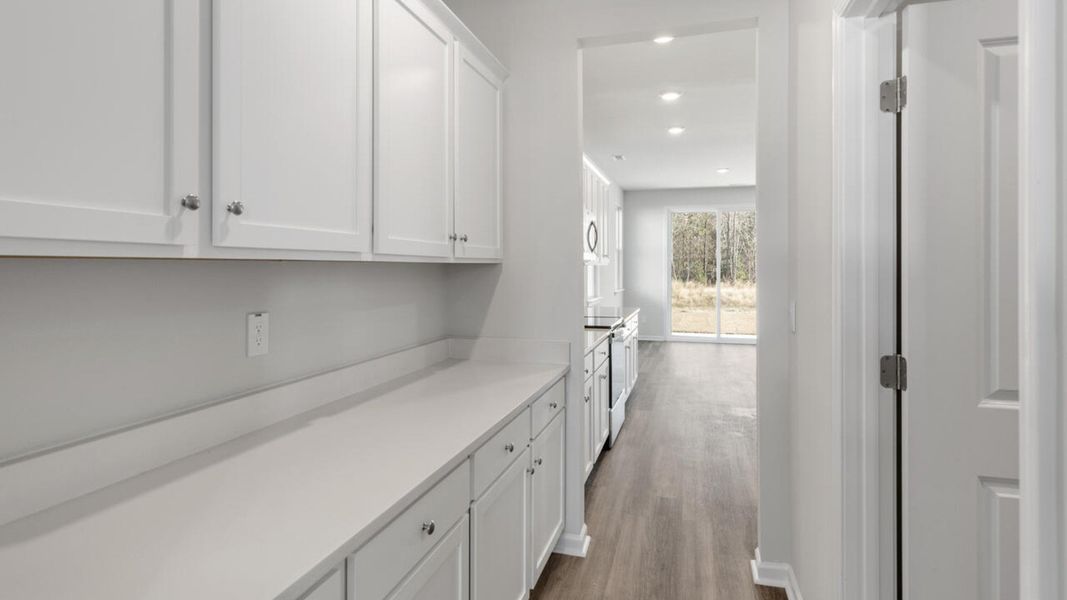 Representative unfurnished interior of a home built from the HARBOR OAK by D.R. Horton in Indigo Preserve, Leland (Image 22).