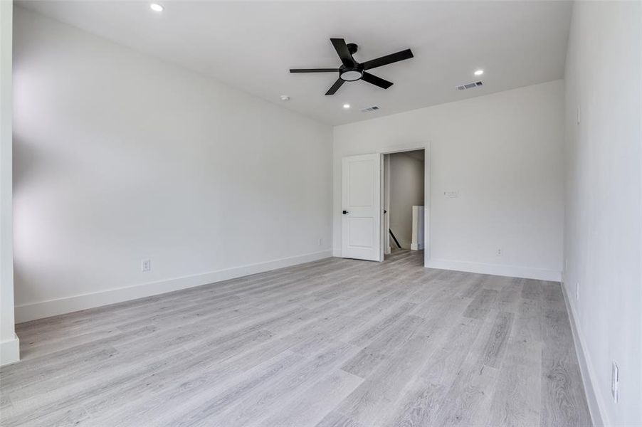 Spare room with ceiling fan, light wood-type flooring, and recessed lighting Spare room with ceiling fan, light wood-type flooring, and recessed lighting