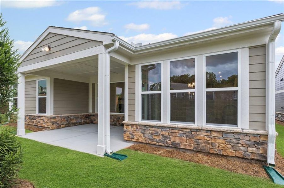 Front exterior of a new home in Laurel Farms, Dallas, GA, highlighting curb appeal (Image 27). Front exterior of a new home in Laurel Farms, Dallas, GA, highlighting curb appeal (Image 27).