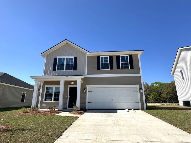 Front exterior of a new home in Grand Reserve, Hinesville, GA, highlighting curb appeal (Image 1). Front exterior of a new home in Grand Reserve, Hinesville, GA, highlighting curb appeal (Image 1).