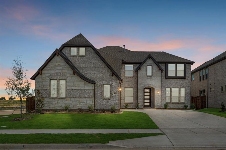 Front exterior of a new home in Wildflower Ranch 60-65, Justin, TX, highlighting curb appeal (Image 21). Front exterior of a new home in Wildflower Ranch 60-65, Justin, TX, highlighting curb appeal (Image 21).