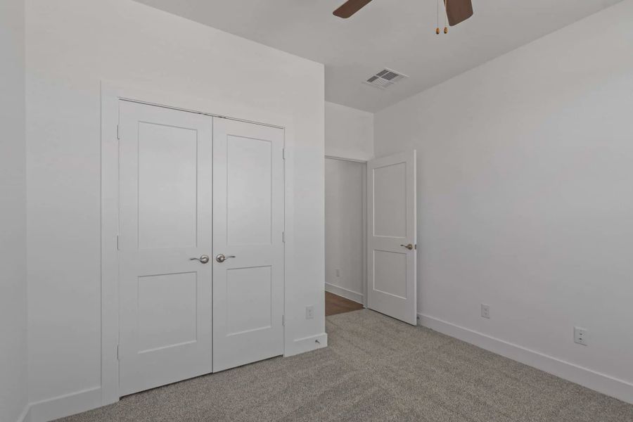 Representative unfurnished interior of a home built from the Carriagehouse by Chesmar Homes in Meridiana Townhomes, Iowa Colony (Image 73).