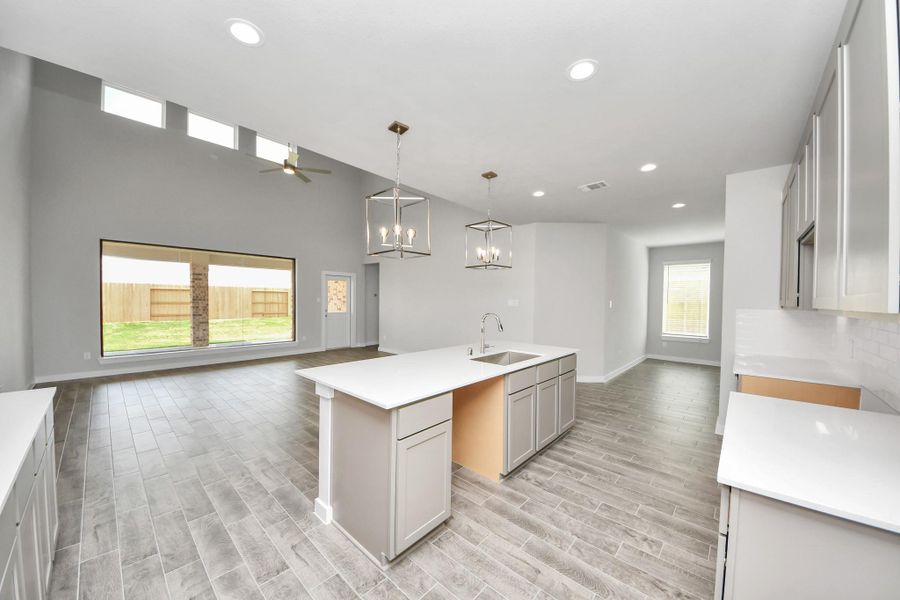 All of this overlooks your expansive family room, creating a perfect space for culinary delights and family gatherings.