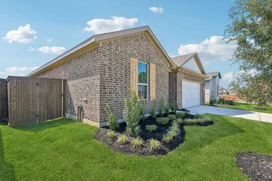 Front exterior of a new home in Harrington Trails, New Caney, TX, highlighting curb appeal (Image 20).