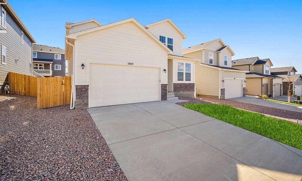Exterior details and patio area of a home in Ridge at Lorson Ranch, Colorado Springs (Image 17).