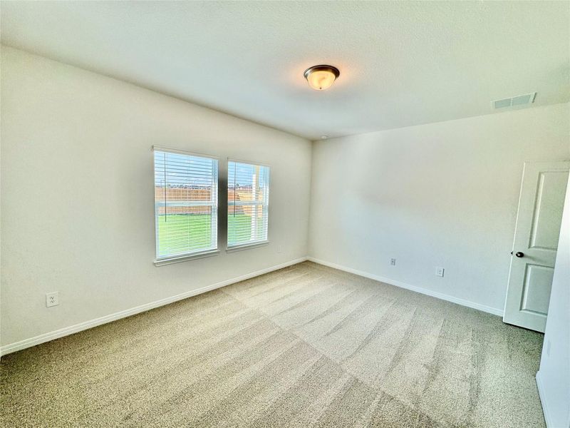 Unfurnished room featuring light colored carpet and baseboards Unfurnished room featuring light colored carpet and baseboards
