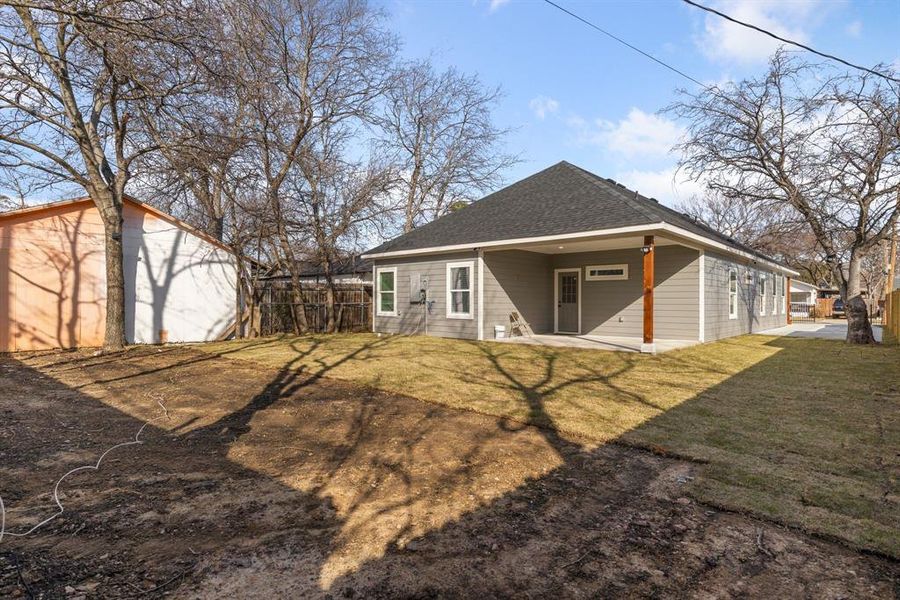 Back of house featuring a yard and a patio