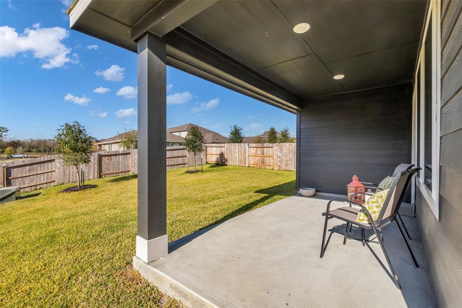 Enjoy a morning cup of coffee on the large covered back patio.