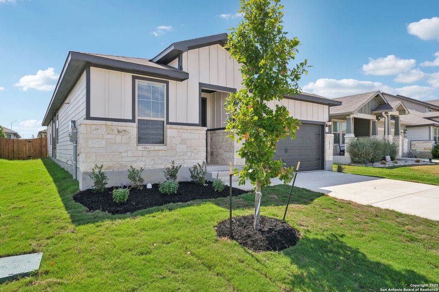 Front exterior of a new home in Catalina, Converse, TX, highlighting curb appeal (Image 1).