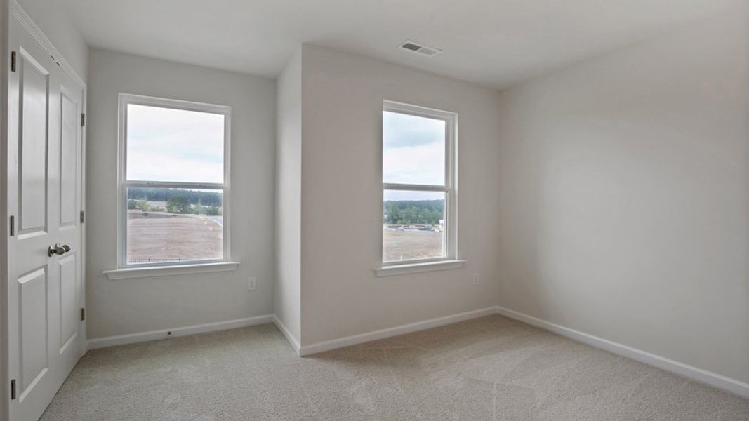 Spacious, unfurnished interior of a new home in The Grove at Matthews Landing, Fuquay Varina (Image 25).