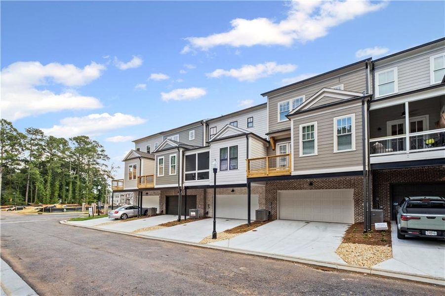 Front exterior of a new home in Devin's Shire, Kennesaw, GA, highlighting curb appeal (Image 20).