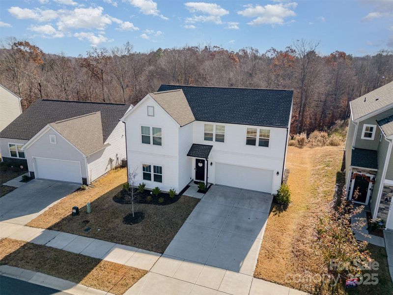 Front exterior of a new home in , Mount Holly, NC, highlighting curb appeal (Image 26).