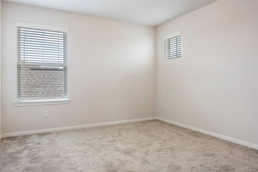 Spacious, unfurnished interior of a new home in Sunterra, Katy (Image 36).