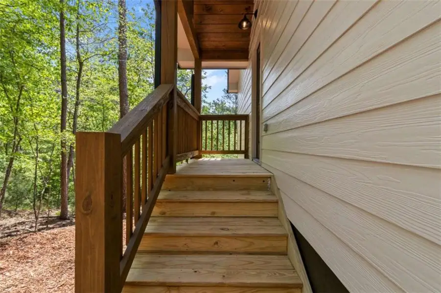 Exterior details and patio area of a home in , Ellijay (Image 26).