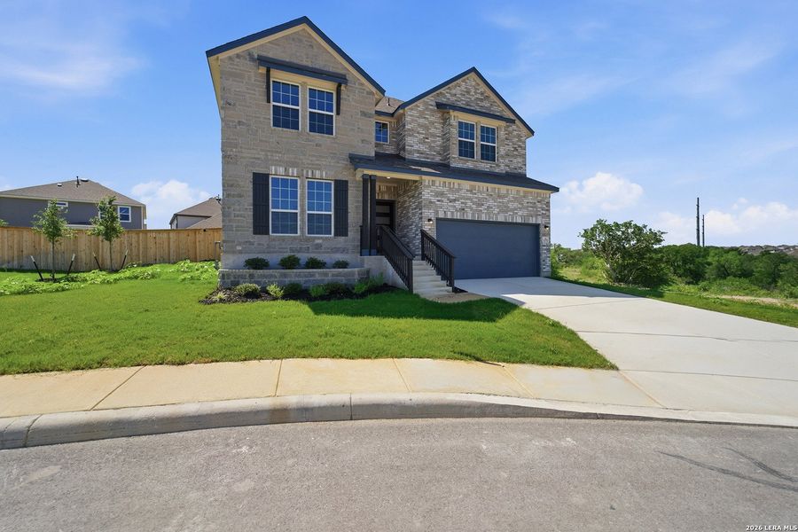 Front exterior of a new home in Arcadia Ridge, San Antonio, TX, highlighting curb appeal (Image 22).