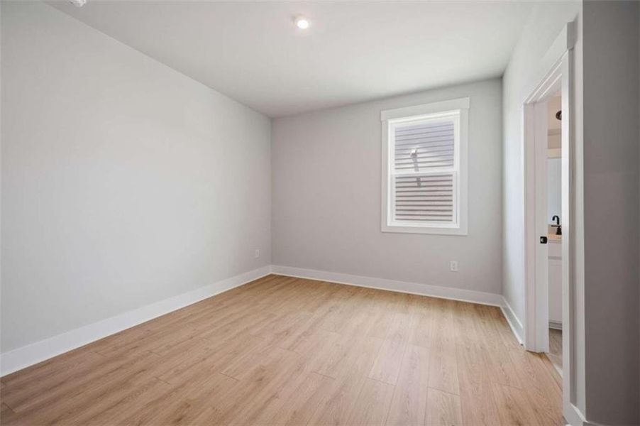Spacious, unfurnished interior of a new home in The Paddocks at Doc Hughes, Buford (Image 24).