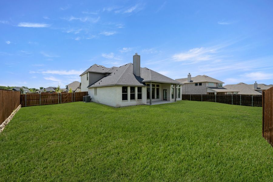 Exterior details and patio area of a home in Hayes Crossing, Midlothian (Image 3).