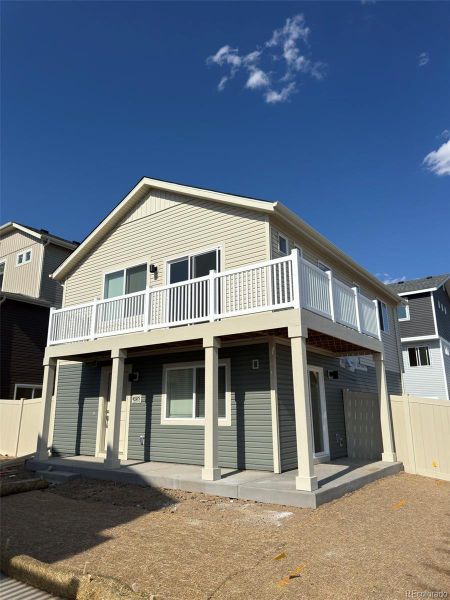 Front exterior of a new home in Muegge Farms, Bennett, CO, highlighting curb appeal (Image 21).