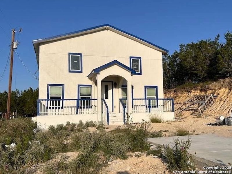 Front exterior of a new home in , Bandera, TX, highlighting curb appeal (Image 1). Front exterior of a new home in , Bandera, TX, highlighting curb appeal (Image 1).
