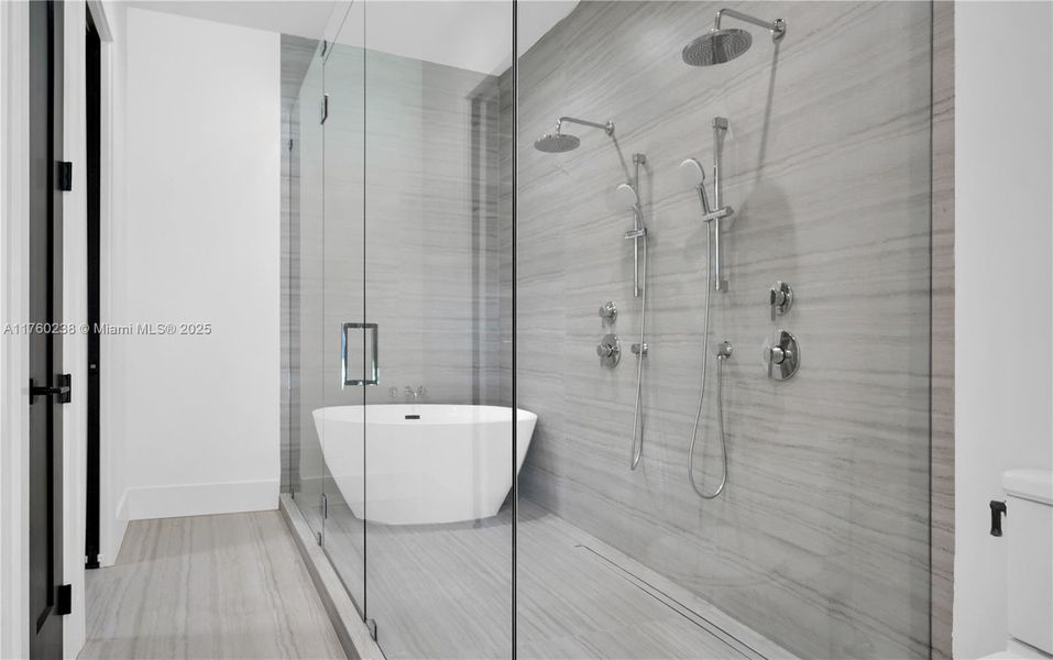 Dual shower heads, overhead rainfall shower, & tub