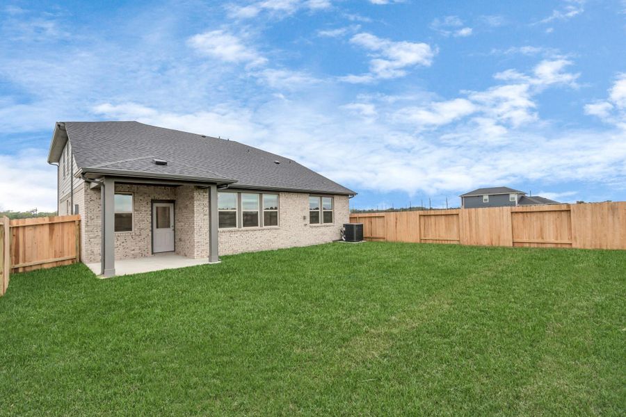 Exterior details and patio area of a home in Montgomery Ridge, Montgomery (Image 2).