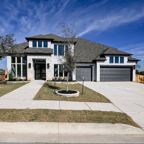 Front exterior of a new home in Johnson Ranch, Bulverde, TX, highlighting curb appeal (Image 22).