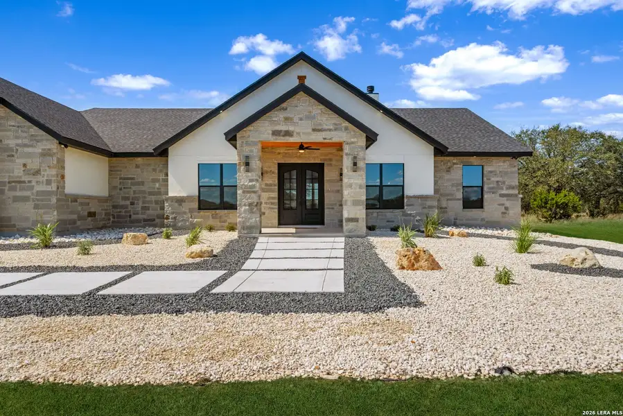 Front exterior of a new home in , Bandera, TX, highlighting curb appeal (Image 1). Front exterior of a new home in , Bandera, TX, highlighting curb appeal (Image 1).