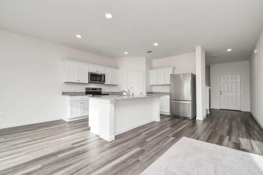 Furnished interior view inside a new home in Sunterra, Katy (Image 6).