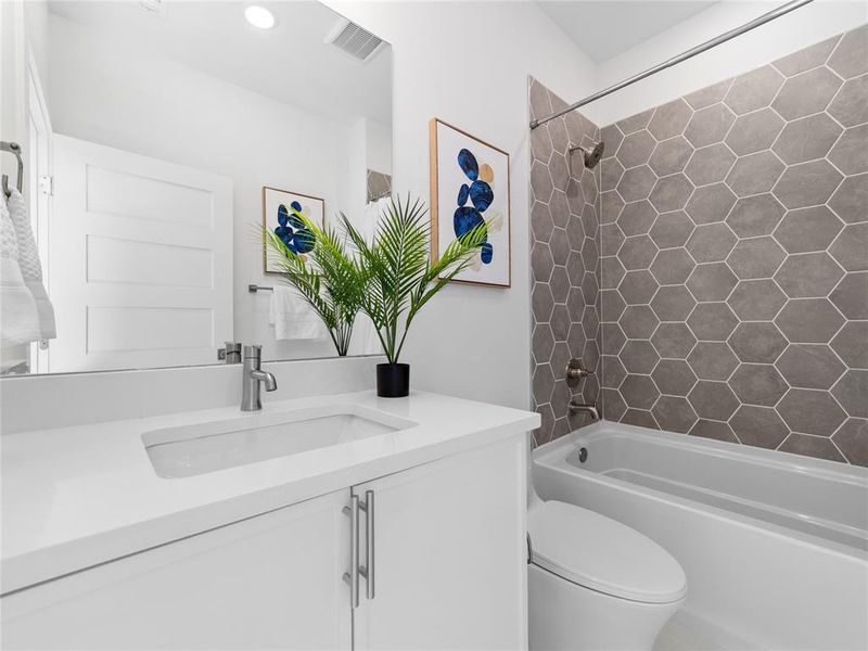 Bathroom with vanity and  shower combination
