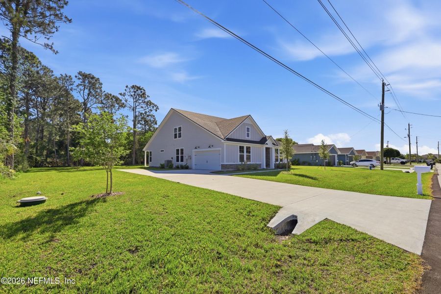 Exterior details and patio area of a home in Palm Coast Homes, Palm Coast (Image 32).