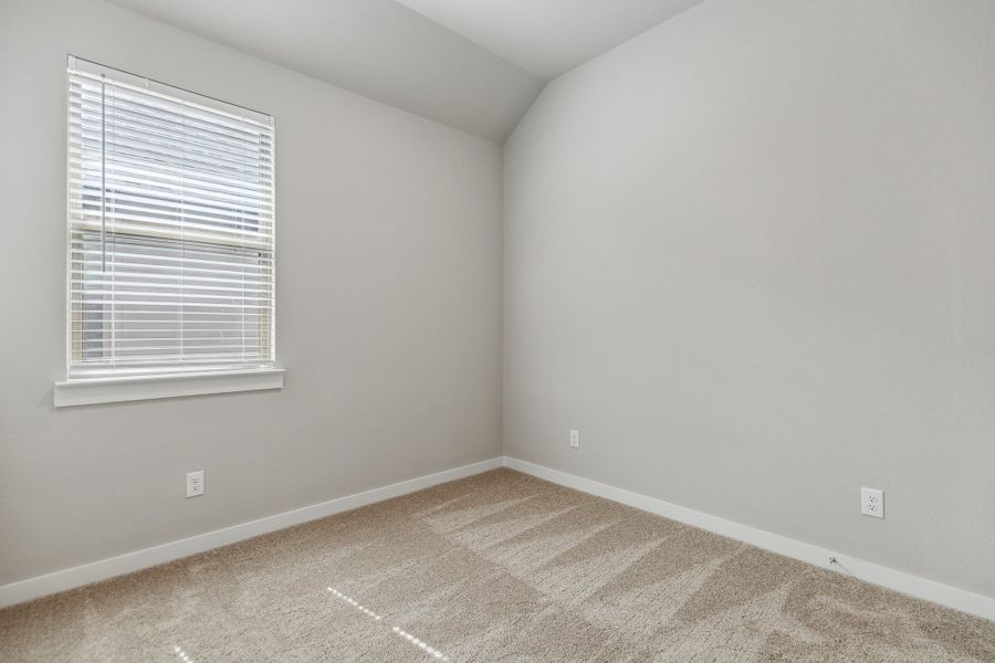 Bedroom in the Birch home plan by Trophy Signature Homes – REPRESENTATIVE PHOTO