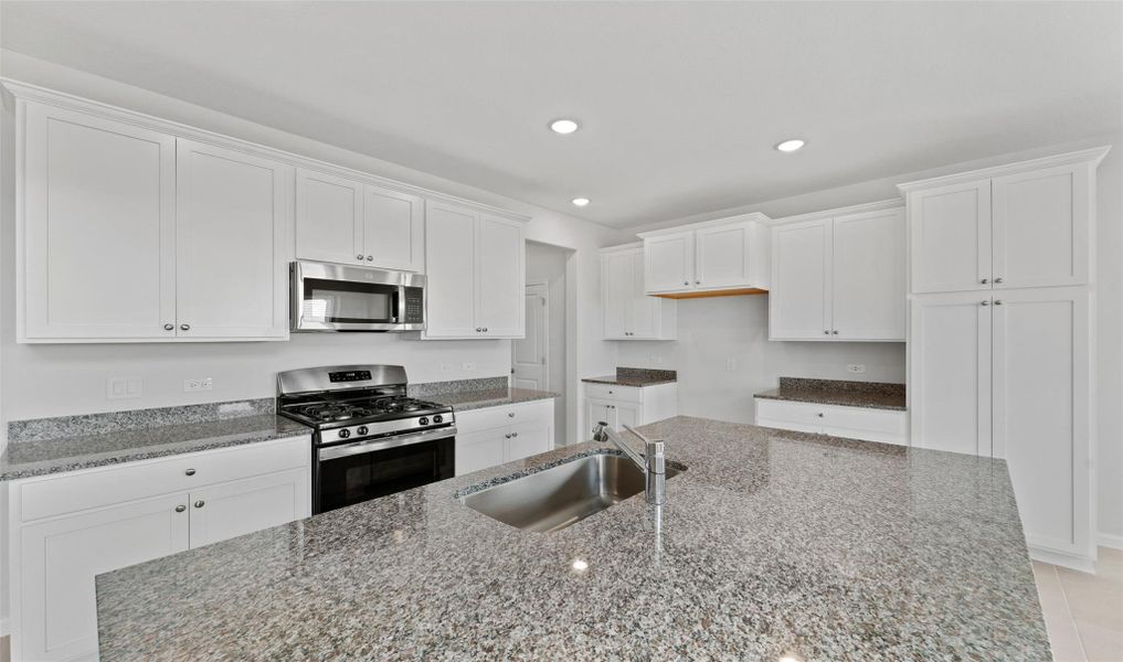 Lovely island kitchen (*Photo not of actual home and used for illustration purposes only.)