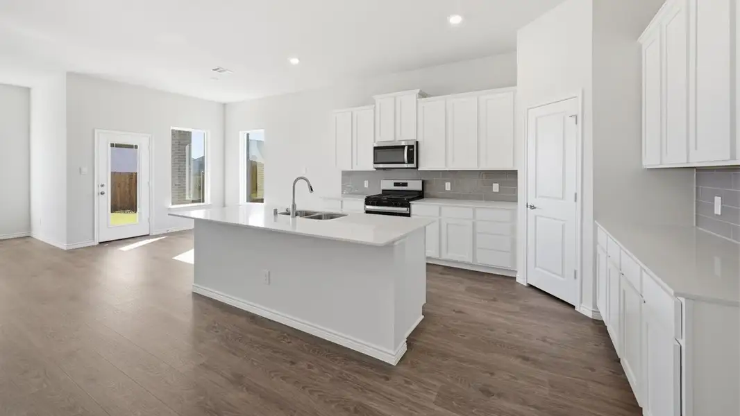 Furnished interior view inside a new home in Fireside by the Lake, Garland (Image 4).