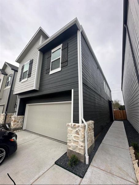 Front exterior of a new home in McClendon Park Village, Houston, TX, highlighting curb appeal (Image 2).