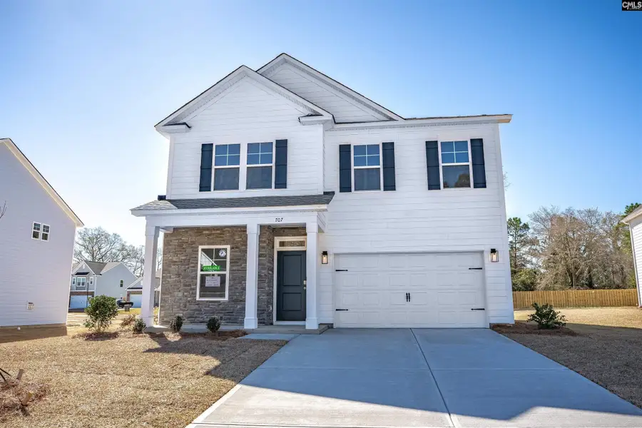 Front exterior of a new home in Raglins Creek, Lugoff, SC, highlighting curb appeal (Image 1).