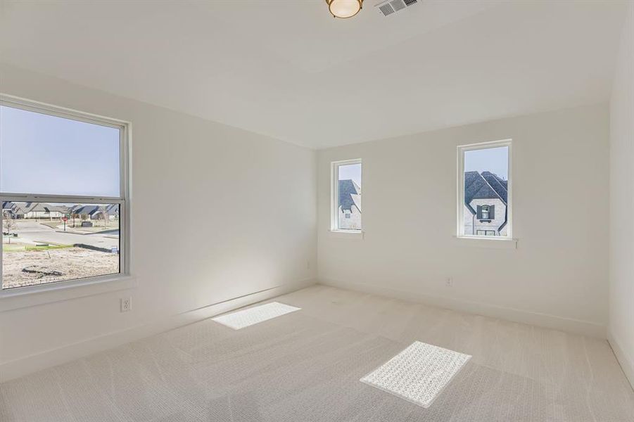 Spare room with carpet flooring and baseboards