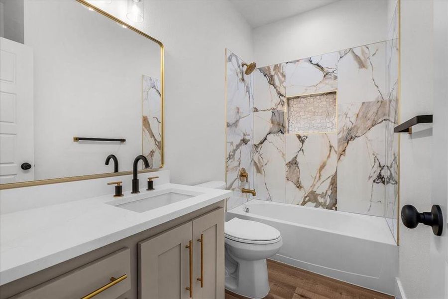 Full bathroom featuring shower / bath combination, vanity, toilet, and wood-type flooring