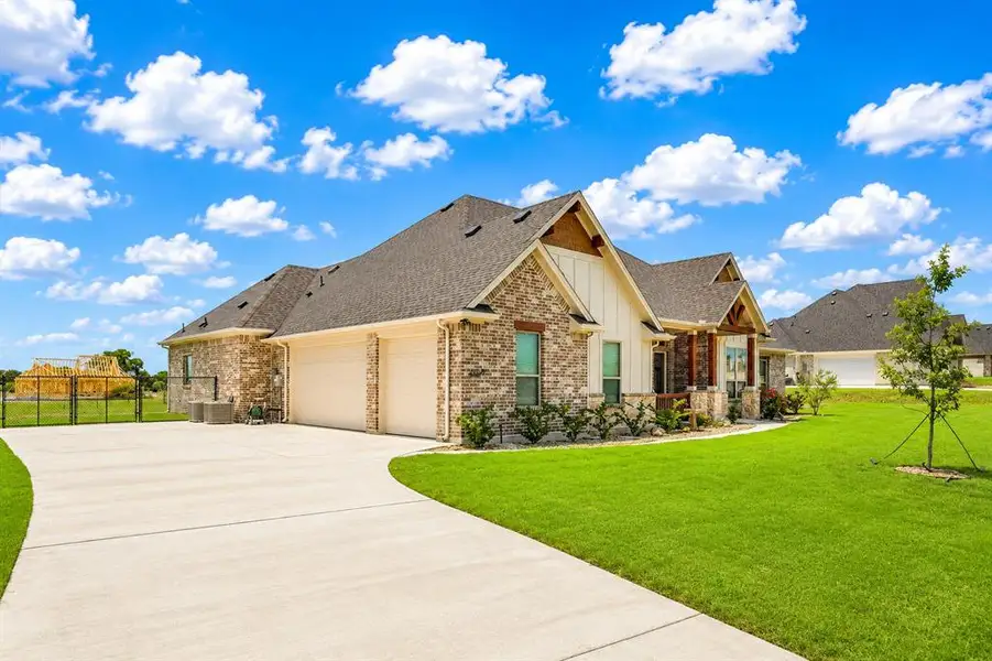 Front exterior of a new home in , Waxahachie, TX, highlighting curb appeal (Image 23).
