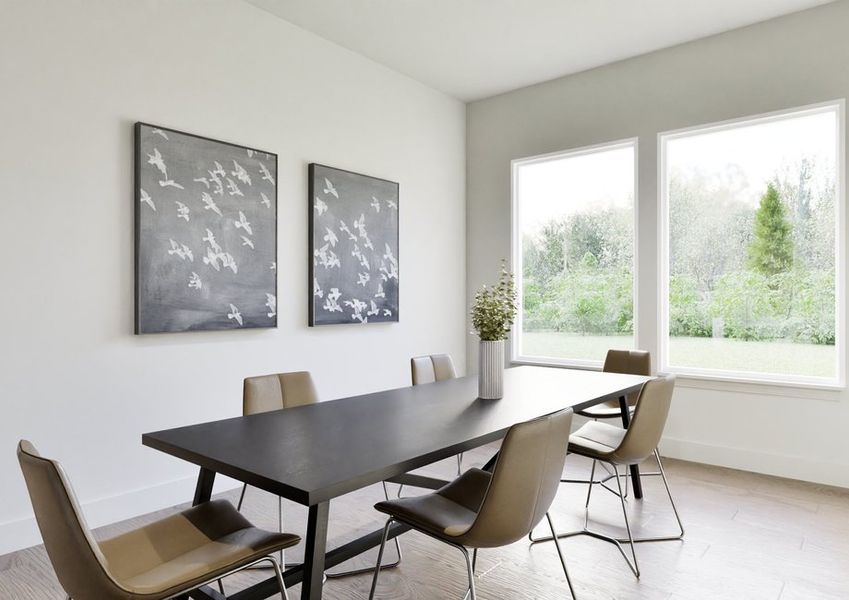 A modern dining room with a black table, six chairs, two bird-themed paintings, and a vase. Large windows reveal a lush green view. Bright and serene ambiance.