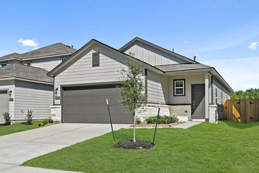 Front exterior of a new home in Northpark South, Porter, TX, highlighting curb appeal (Image 1). Front exterior of a new home in Northpark South, Porter, TX, highlighting curb appeal (Image 1).