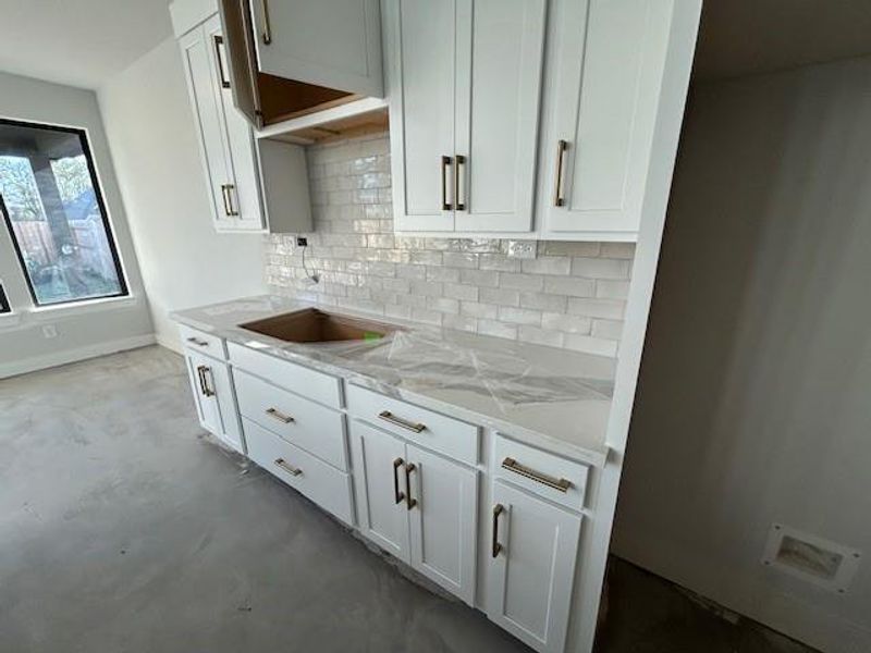 Better view of the backsplash tile and hardware that has ben installed.