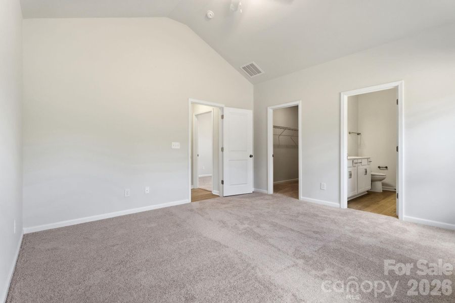 Primary Bedroom with Vaulted Ceiling