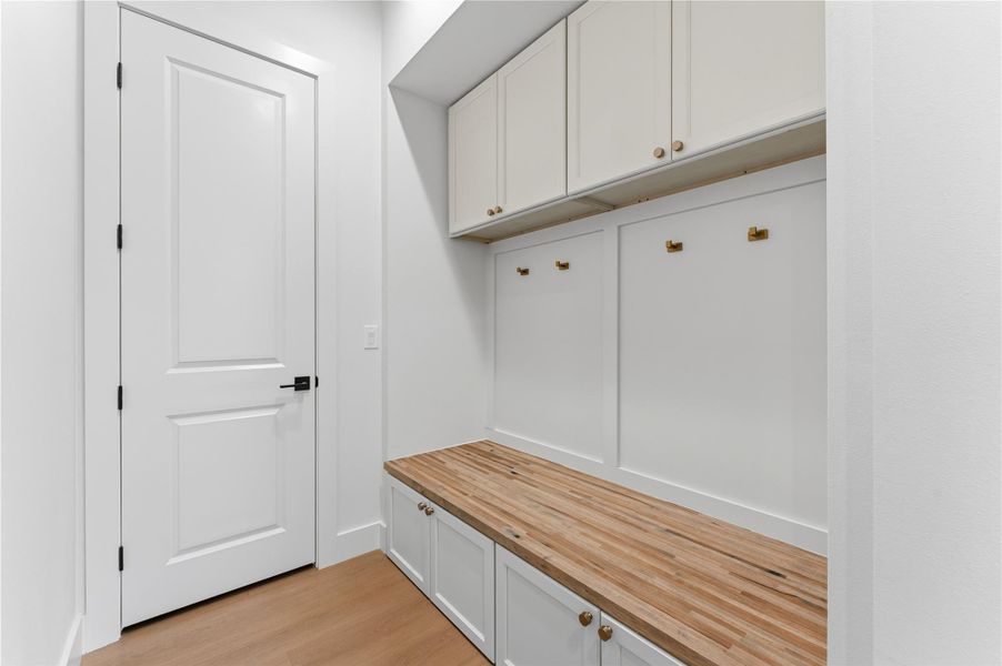Mudroom featuring light wood-style flooring
